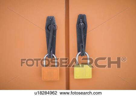 Stock Image - locked industrial doors. Fotosearch