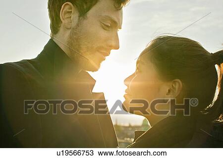 Stock Image - Looking each other deep in the eyes. Fotosearch