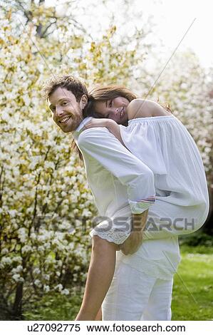 Love couple having fun in the park View Large Photo Image Stock Photography - Love couple having fun in the park. Fotosearch