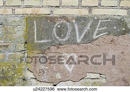 LOVE written on a wall View Large Photo Image Stock Photograph - LOVE written on a wall. Fotosearch