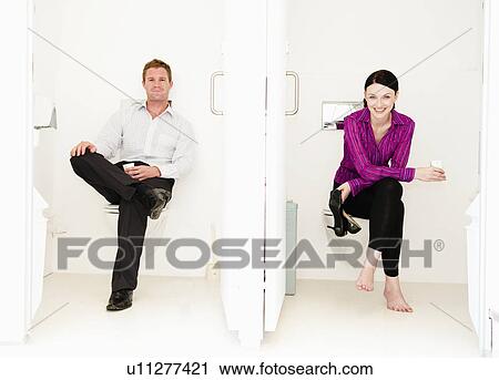 Stock Image - Male and female relax in toilets. Fotosearch