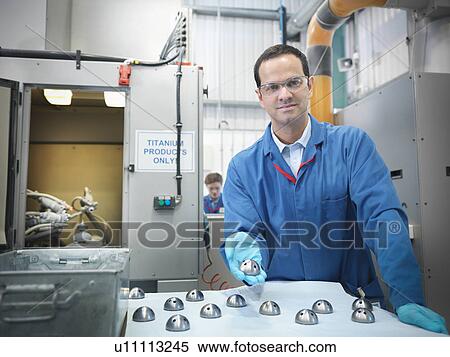 Stock Photography - Male scientist with product. Fotosearch