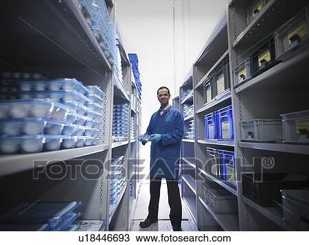 Male worker in storeroom View Large Photo Image Stock Image - Male worker in storeroom. Fotosearch