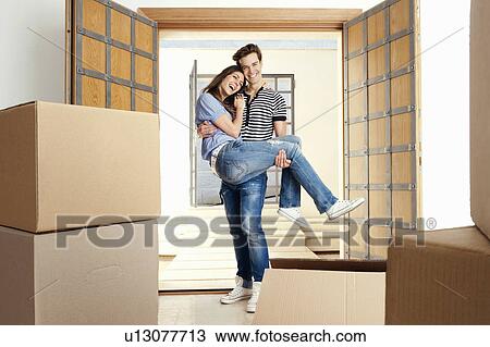 Man carrying girlfriend over threshold View Large Photo Image Stock Image - Man carrying girlfriend over threshold. Fotosearch