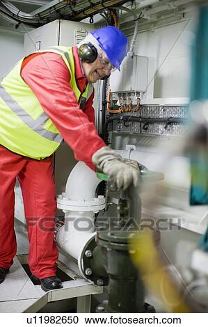Man doing maintenance works View Large Photo Image Stock Image - Man doing maintenance works. Fotosearch