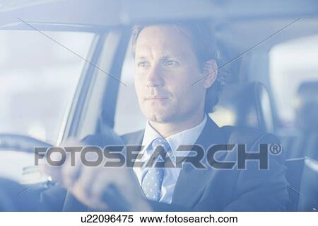 Stock Photography - Man driving a car. Fotosearch