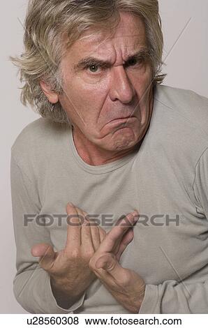 Man frowning and making innocent gesture View Large Photo Image Stock Photo - Man frowning and making innocent gesture. Fotosearch