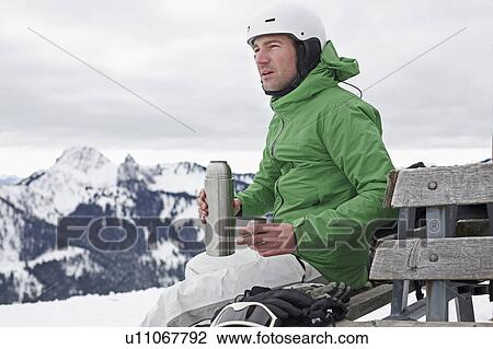 Man in mountains taking a break View Large Photo Image Stock Image - Man in mountains taking a break. Fotosearch