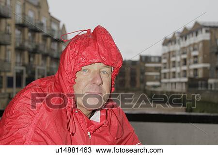Man in raincoat View Large Photo Image Stock Image - Man in raincoat. Fotosearch