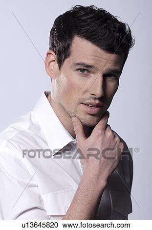 Man in studio View Large Photo Image Stock Image - Man in studio. Fotosearch