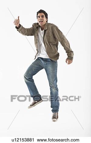 Man jumping on a white background View Large Photo Image Stock Image - Man jumping on a white background. Fotosearch