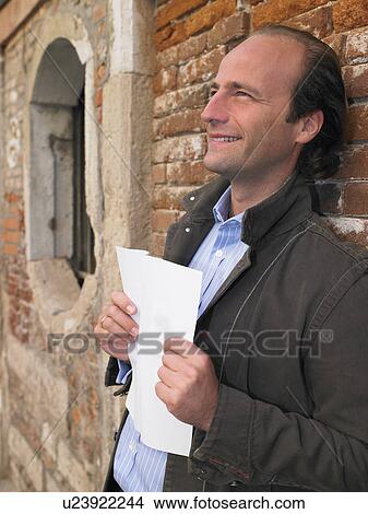 Man reading a letter View Large Photo Image Picture - Man reading a letter. Fotosearch