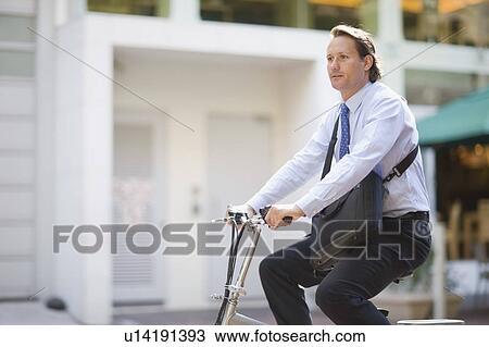 Stock Image - Man riding a bicycle. Fotosearch