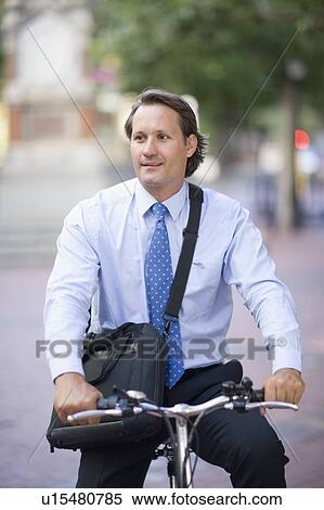 Man riding a bicycle View Large Photo Image Stock Photography - Man riding a bicycle. Fotosearch