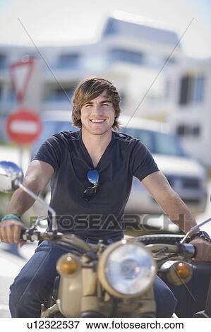 Man riding motorcycle View Large Photo Image Stock Photo - Man riding motorcycle. Fotosearch
