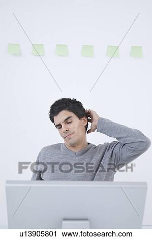 Man stretching at computer View Large Photo Image Stock Image - Man stretching at computer. Fotosearch