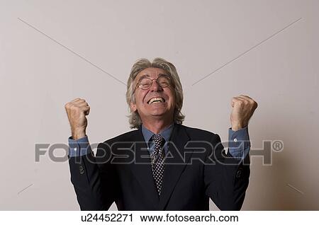Stock Image - Man with arms in the air. Fotosearch