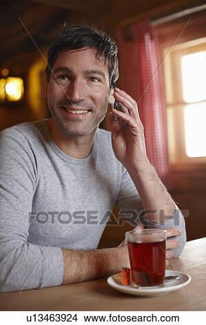 Man with Cellphone and Tea View Large Photo Image Picture - Man with Cellphone and Tea. Fotosearch