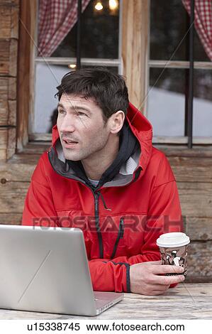 Stock Photography - Man with Laptop and Coffee. Fotosearch