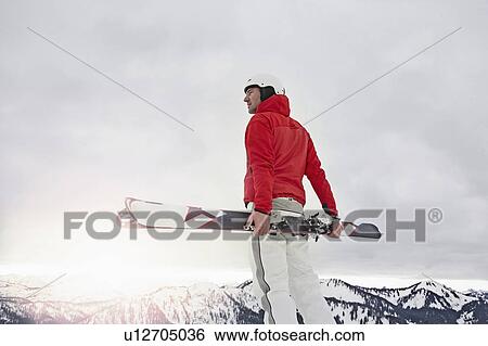 Stock Photograph - Man with Ski in Mountains. Fotosearch
