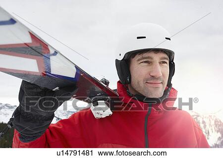 Stock Image - Man with Ski on Shoulders. Fotosearch