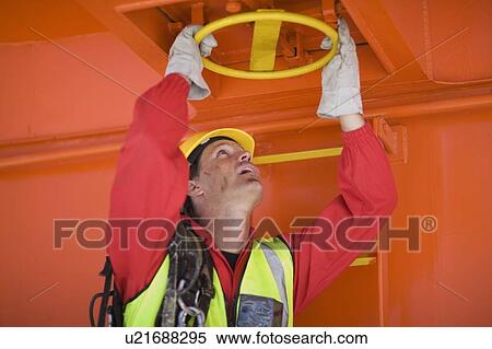 Man working in a harbour View Large Photo Image Stock Photography - Man working in a harbour. Fotosearch