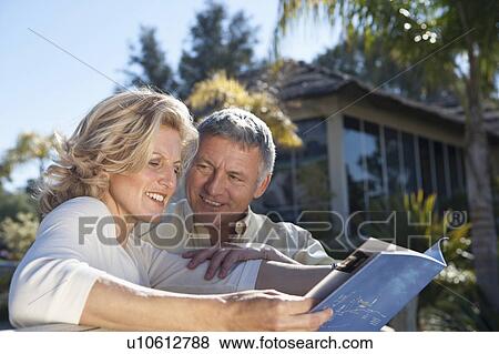 Mature couple studying realestate book View Large Photo Image Stock Photo - Mature couple studying realestate book. Fotosearch