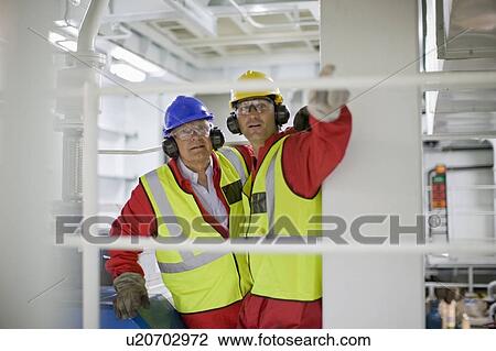 Men doing maintenance works View Large Photo Image Stock Image - Men doing maintenance works. Fotosearch