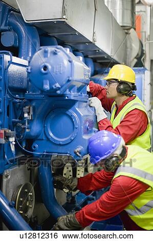 Stock Photograph - Men doing maintenance works. Fotosearch