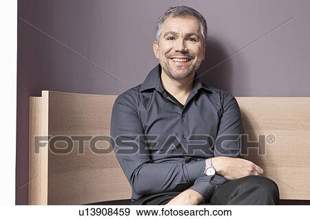 Middle aged man smiling View Large Photo Image Stock Photo - Middle aged man smiling. Fotosearch