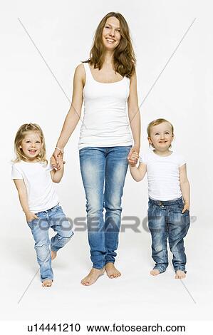 Stock Image - Mother and children holding hands. Fotosearch