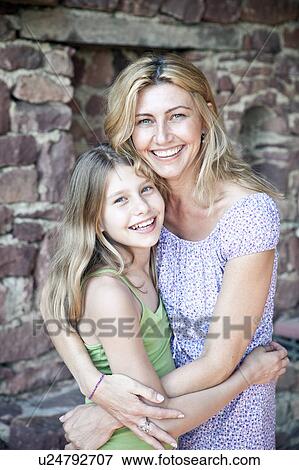 Mother and daughter hug, portrait View Large Photo Image Stock Photo - Mother and daughter hug, portrait. Fotosearch