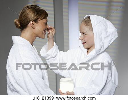 Mother and daughter playing in bathrobes View Large Photo Image Stock Photo - Mother and daughter playing in bathrobes. Fotosearch