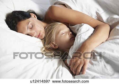 Stock Photo - Mother and daughter sleeping. Fotosearch