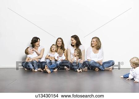 Picture - Mothers and children sitting together. Fotosearch