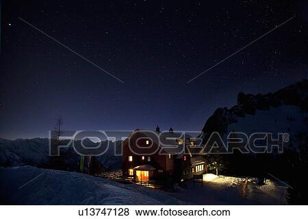 Stock Photo - Mountain hut at night. Fotosearch