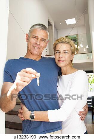 New home owners with key View Large Photo Image Stock Image - New home owners with key. Fotosearch