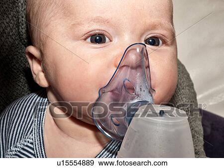 Newborn boy doing inhalation therapy View Large Photo Image Stock Photo - Newborn boy doing inhalation therapy. Fotosearch
