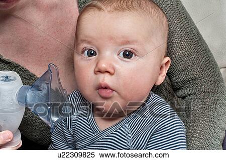 Newborn boy doing inhalation therapy View Large Photo Image Stock Photography - Newborn boy doing inhalation therapy. Fotosearch