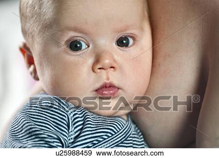 Stock Photo - Newborn boy with mum. Fotosearch