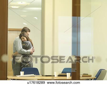 Office couple cuddling View Large Photo Image Stock Photo - Office couple cuddling. Fotosearch