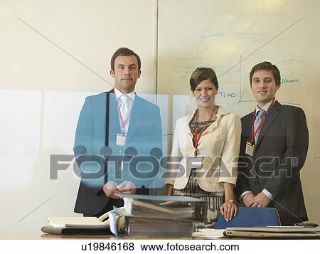 Stock Photo - Office executives at desk. Fotosearch