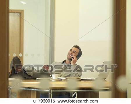 Office man with feet on desk View Large Photo Image Stock Photography - Office man with feet on desk. Fotosearch