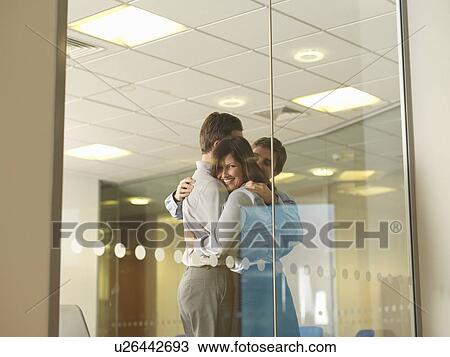Office staff group hug View Large Photo Image Stock Image - Office staff group hug. Fotosearch