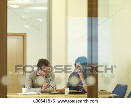 Stock Photograph - Office staff in meeting. Fotosearch