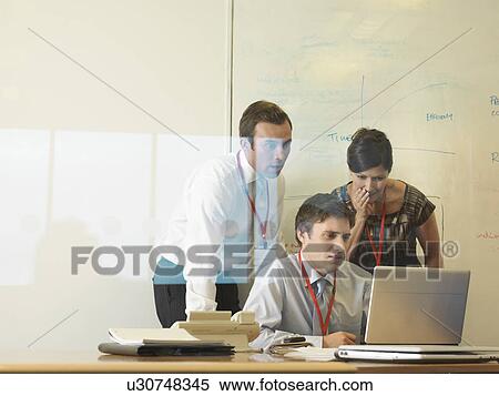 Stock Photography - Office staff in meeting. Fotosearch