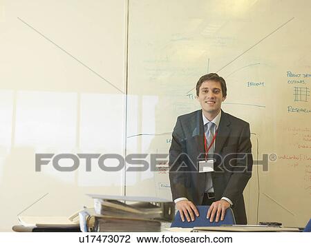 Office worker at desk View Large Photo Image Stock Image - Office worker at desk. Fotosearch