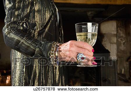 Old ladies hand with glass of wine View Large Photo Image Stock Photo - Old ladies hand with glass of wine. Fotosearch