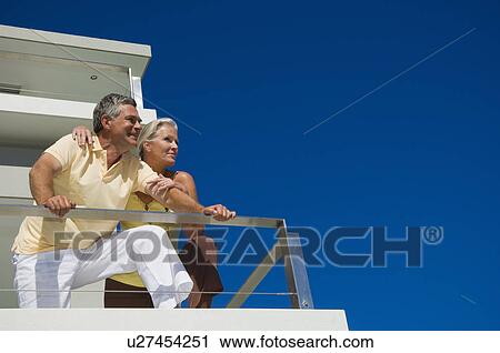 Older couple relaxing at home View Large Photo Image Stock Image - Older couple relaxing at home. Fotosearch
