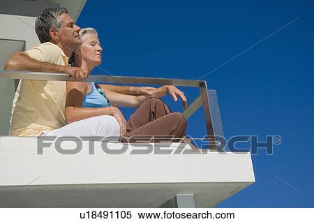 Older couple relaxing at home View Large Photo Image Stock Photography - Older couple relaxing at home. Fotosearch